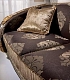 Коричневый текстиль с золотистыми узорами на диване Liberty