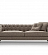 серый тканевый диван с каретной стяжкой