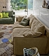 Бежевый диван и зеленое кресло в замше для стильной гостиной Nesting